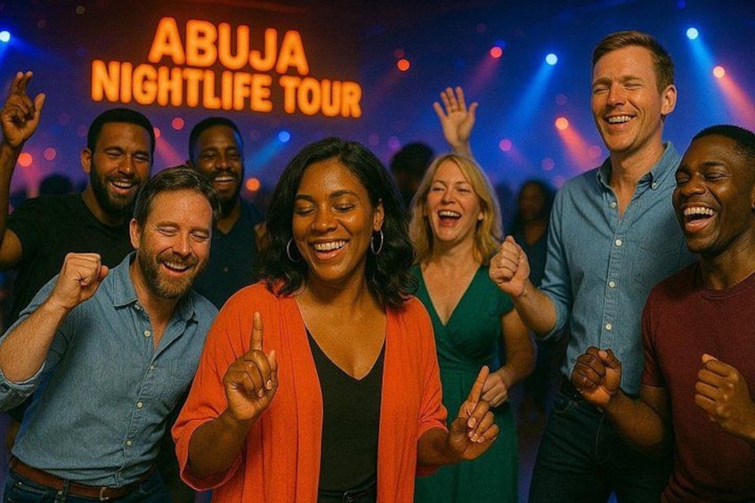 A group of people dancing at an event with a sign that reads 'ABUJA NIGHTLIFE TOUR'. 1