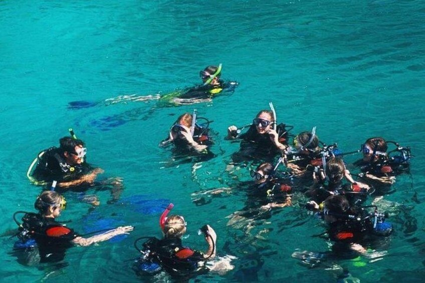 A group of scuba divers in the water. 2