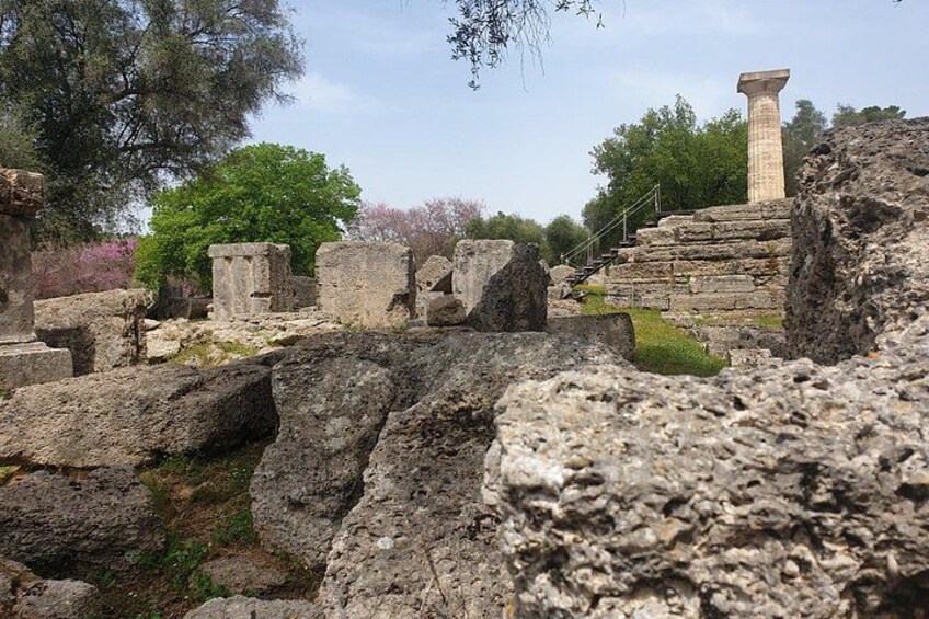 Ancient ruins with stone blocks and a column. 4