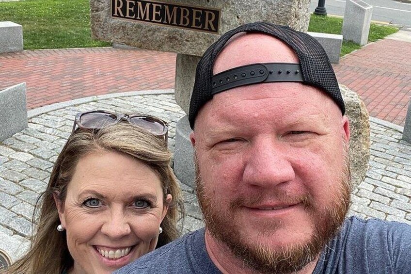 A memorial with the word 'REMEMBER' on a stone. 4