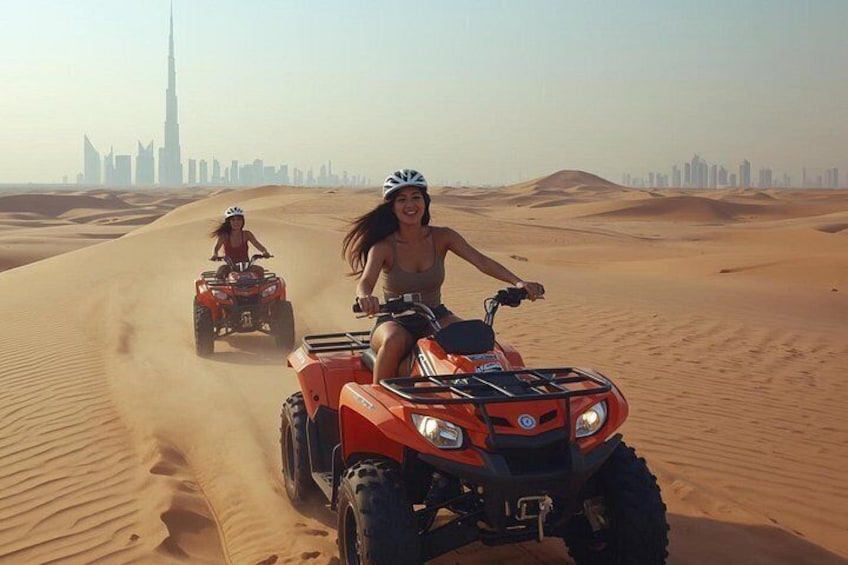Two people riding ATVs in a desert with sand dunes and a city skyline in the background. 1