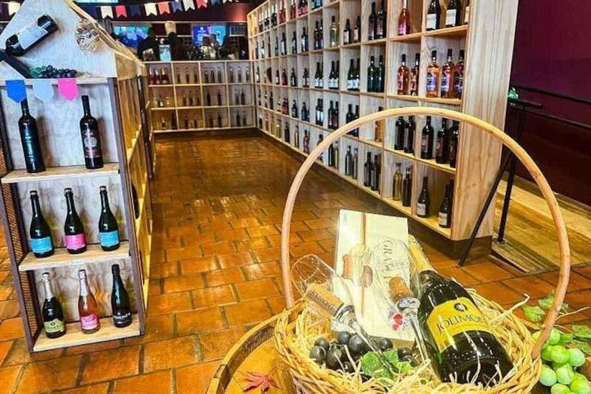 A wine cellar with wooden shelves and a basket of wine bottles. 2