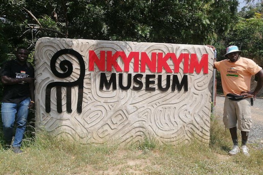A sign for the Nkyrinkyi Museum with a unique design. 4