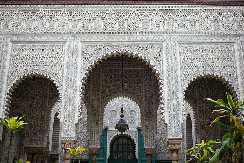 An ornate architectural facade with intricate carvings and arches. 3