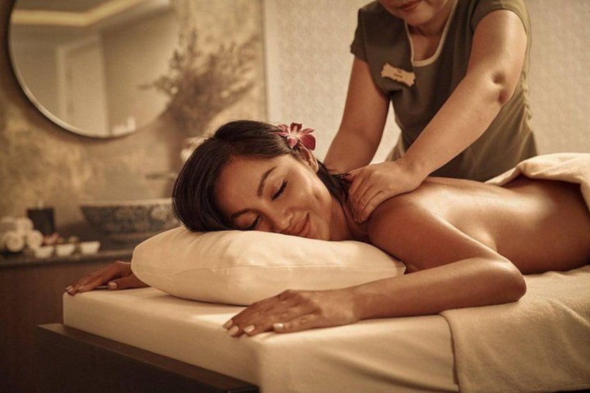 A person receiving a massage in a spa setting. 3