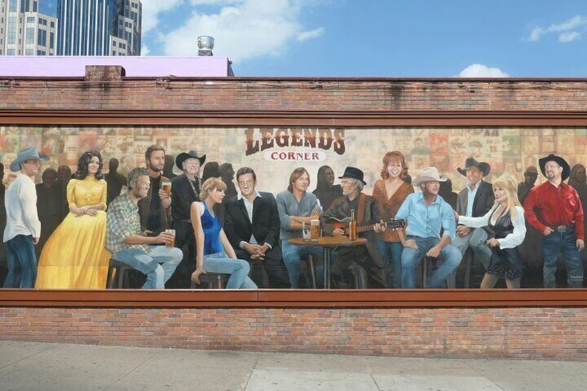 A mural of a group of people sitting at a table with the text "LEGENDS CORNER" above them. 5