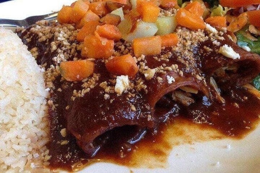 A plate with a meat dish, rice, and diced vegetables. 3