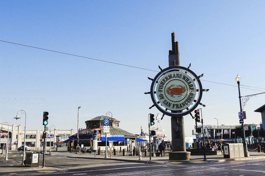 A street intersection with a sign reading 'Fisherman's Wharf of San Francisco.' 3