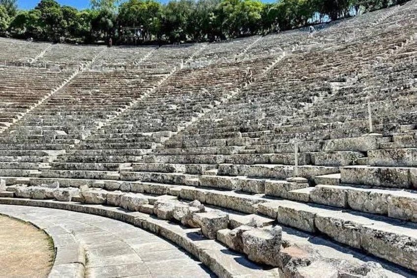 Ancient stone steps leading up to a large amphitheater. 5