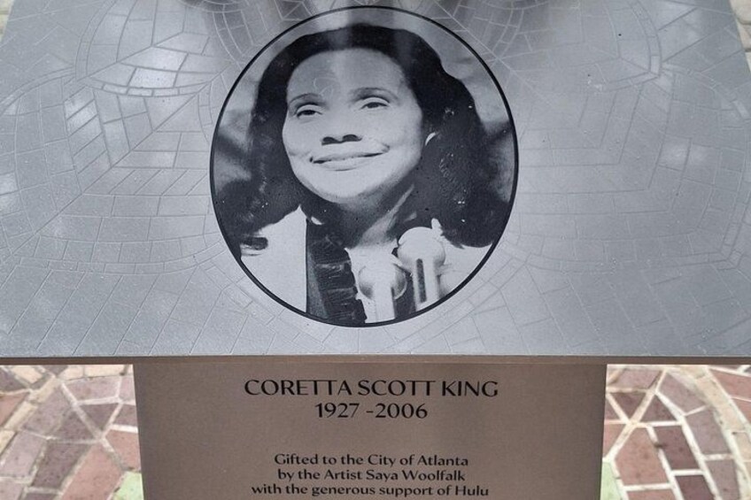 A memorial plaque with a photograph and text. 5