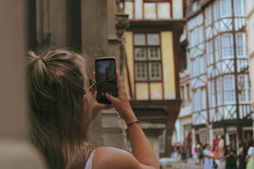 A person taking a photo with a smartphone. 3