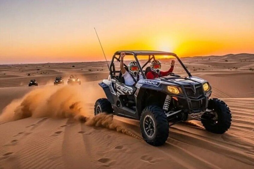 A desert landscape with sand dunes and a sunset. 1