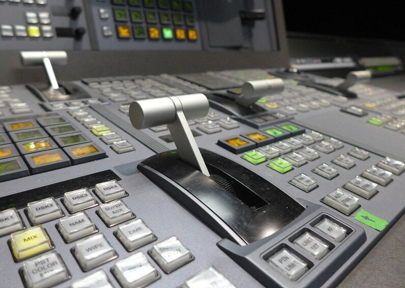 A control panel with various buttons and switches, including labels like 'MIX', 'WIP', and 'SET'. 3