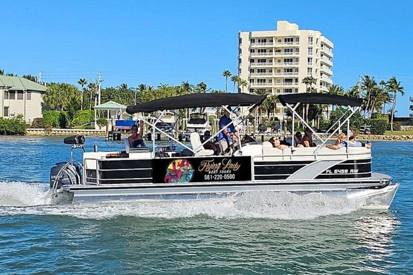 Luxury pontoon boat with 3 sofas and a bar 3