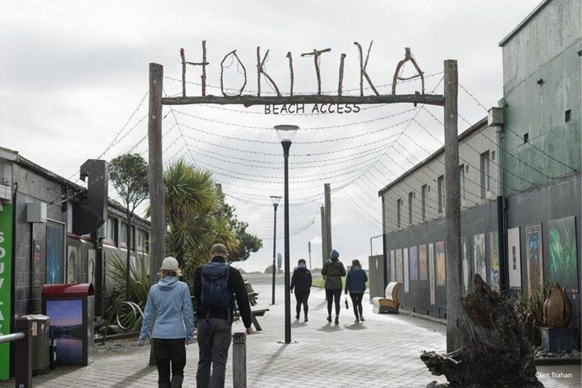 A pedestrian walkway with a sign reading 'HOKITA BEACH ACCESS'. 2