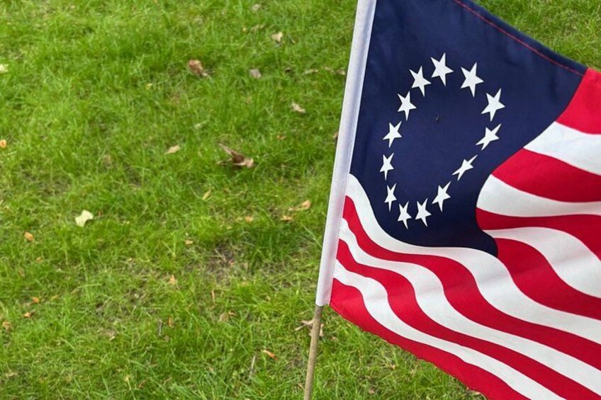 An American flag on a grassy field. 2