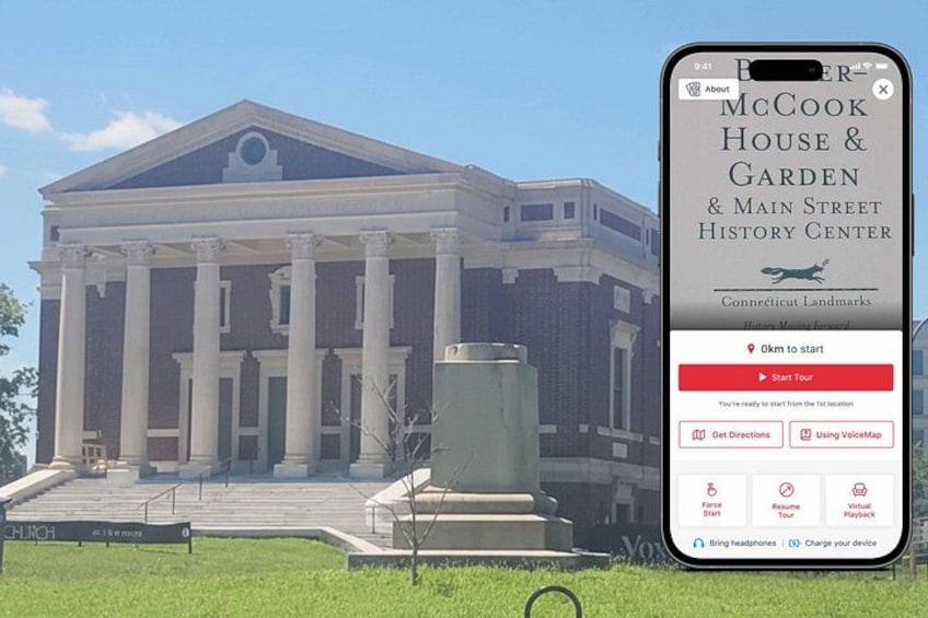 A historic building with columns, a large entrance, and a sign reading 'McCook House & Garden & Main Street History Center'. 1