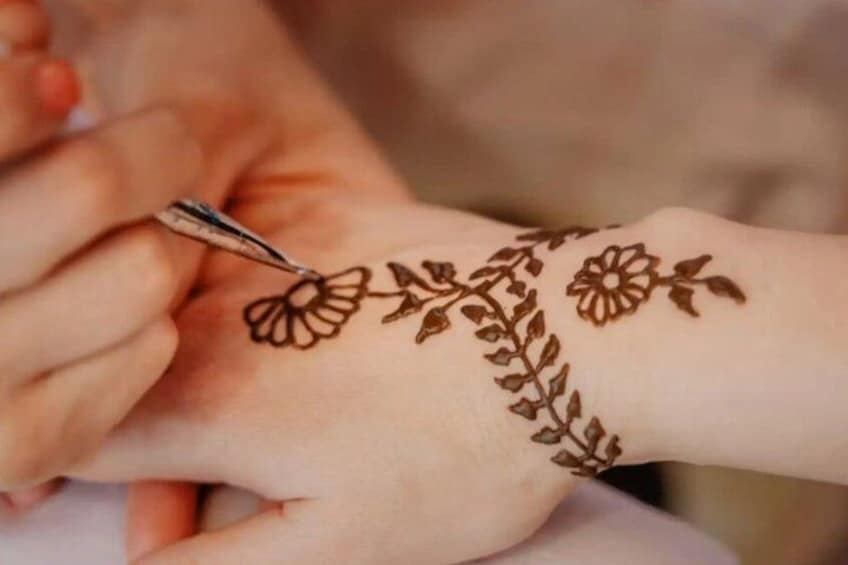 A hand with a henna design. 3