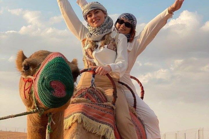 A camel with a rider in traditional attire. 3