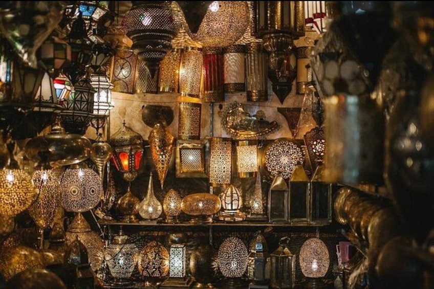 A variety of ornate metal lanterns and decorative items, likely from a market or shop. 2