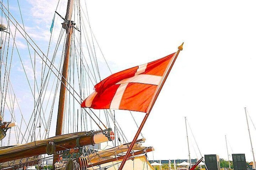 A flag on a ship, rigging, and part of the ship's structure. 4