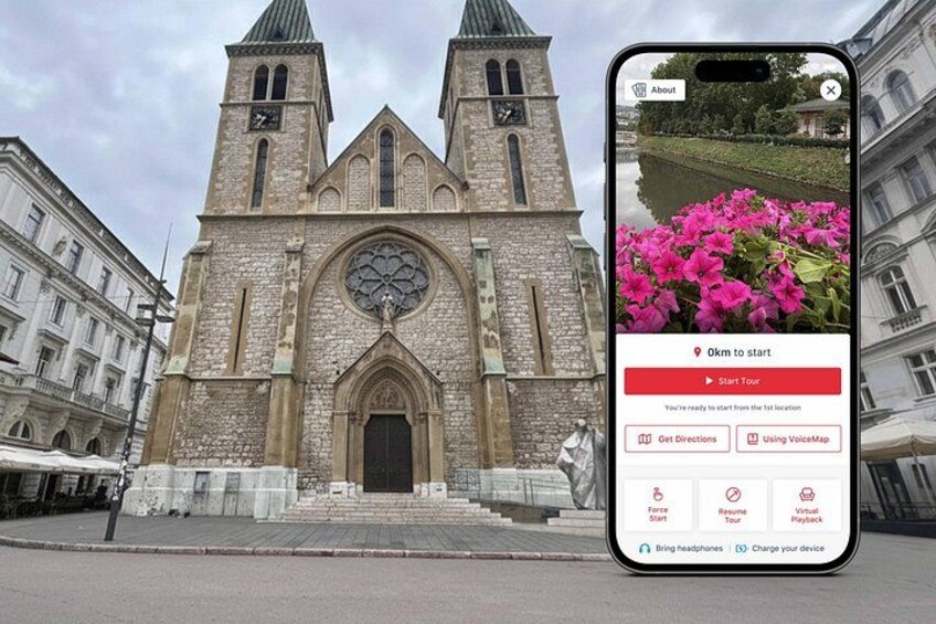 A historic church with two towers and a large arched window. 1