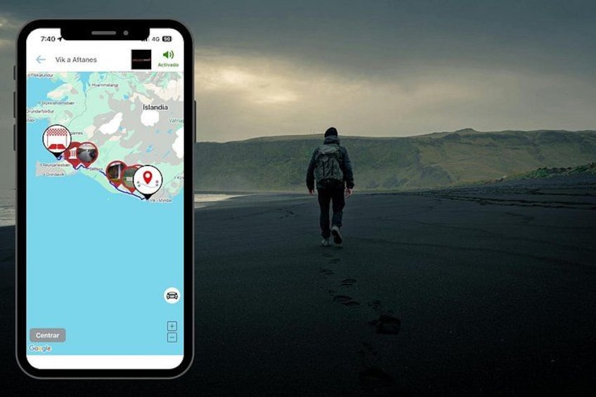 A person walking on a beach with a smartphone displaying a map. 2