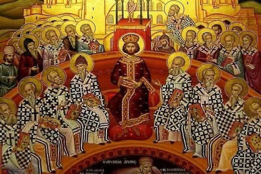 A religious icon with a central figure surrounded by attendants, set against a golden background with architectural elements. 1