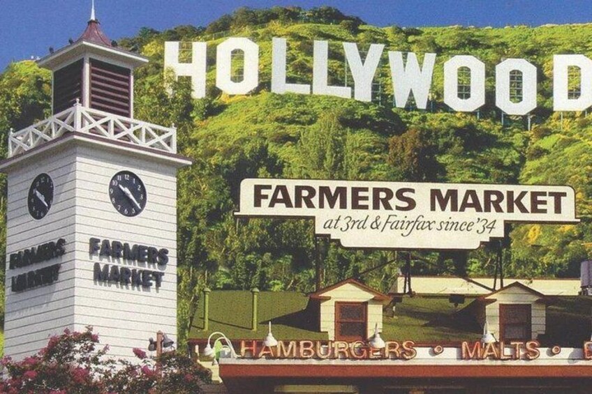 Skilt for Hollywood Farmers Market med et tårn og grøn bevoksning i baggrunden. 4