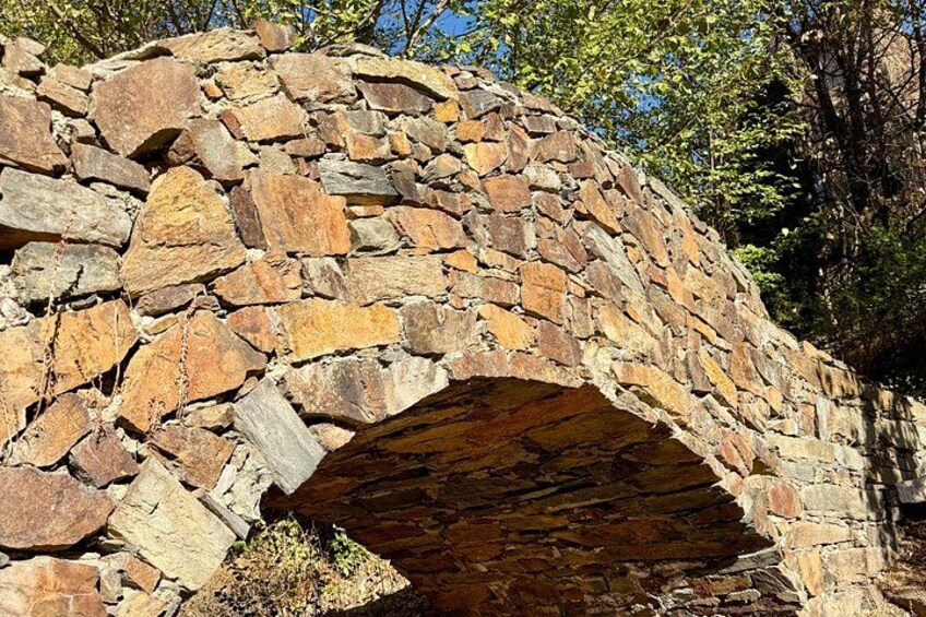 A stone bridge with a natural arch. 4