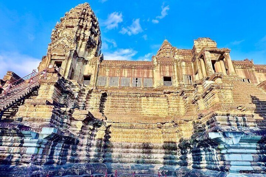 An ancient temple with intricate carvings and a large central tower. 2