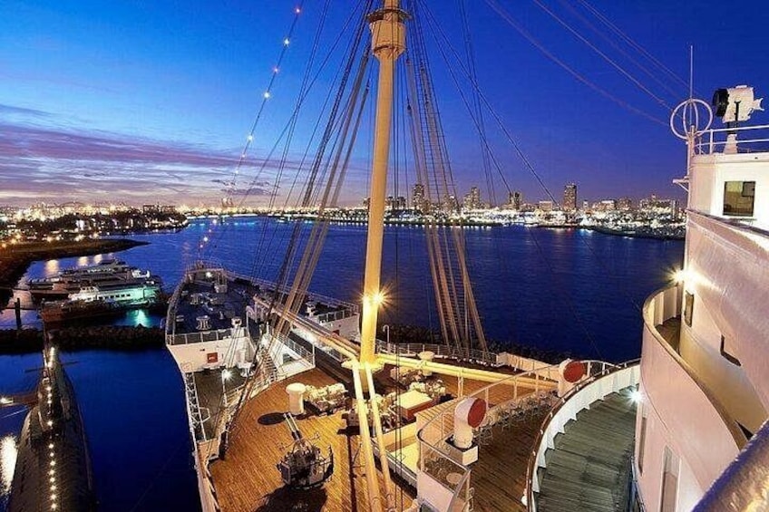 A bridge at dusk with a cityscape in the background. 3