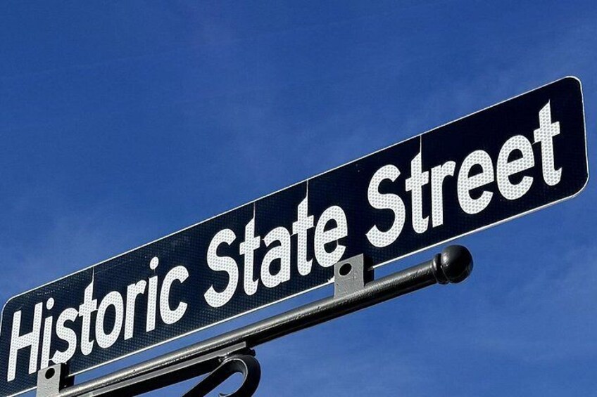 A street sign with 'Historic State Street' written on it. 2