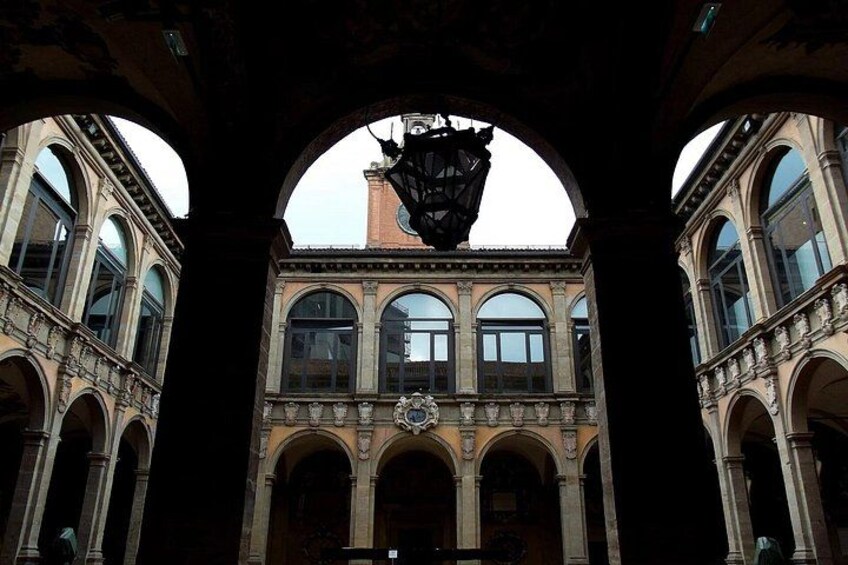An architectural structure with arched windows and a central clock. 5