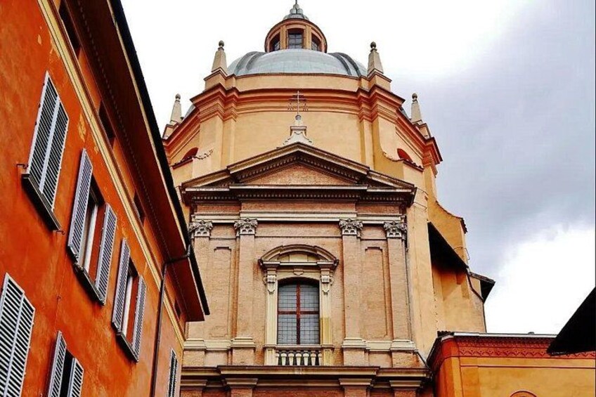 A classical building with a dome and arched windows. 2
