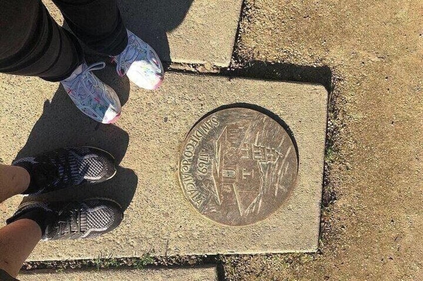 A manhole cover with the text 'CITY OF LOS ANGELES' and the year '1949' on it. 2