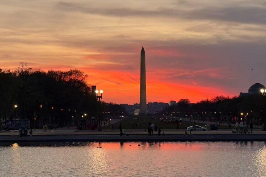 The Washington Monument at sunset with a reflection in the water. 4