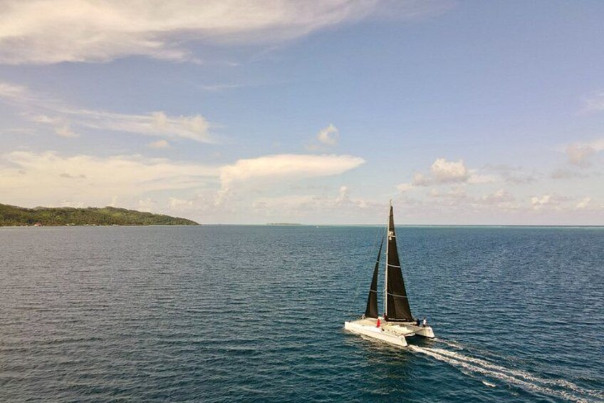 A sailboat on a calm sea with a clear sky. 5