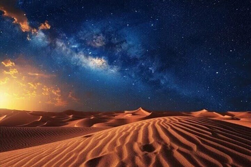 A desert landscape at night with sand dunes under a starry sky. 5