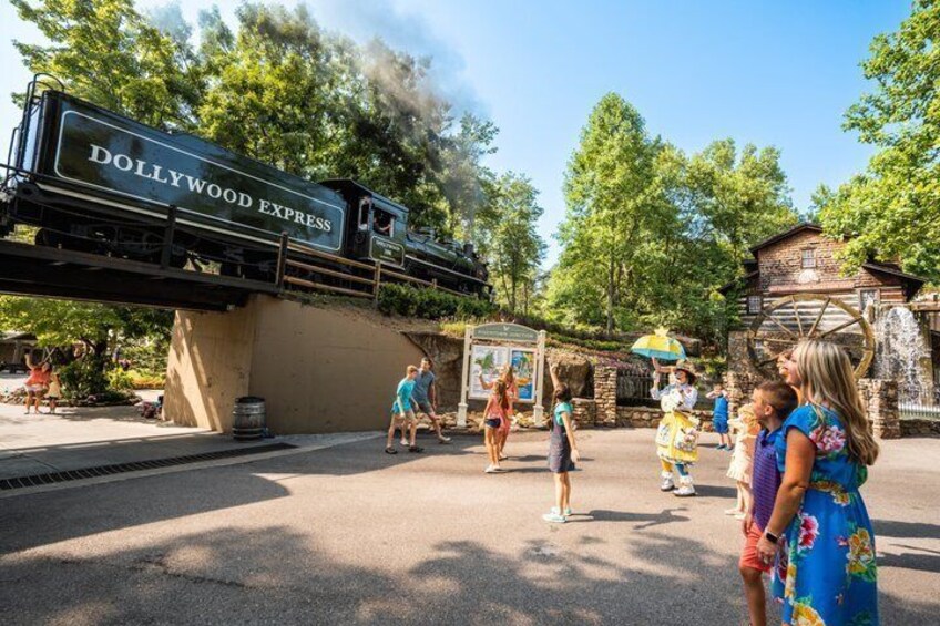 A DOLLYWOOD EXPRESS train, a wooden structure, and a water wheel. 3