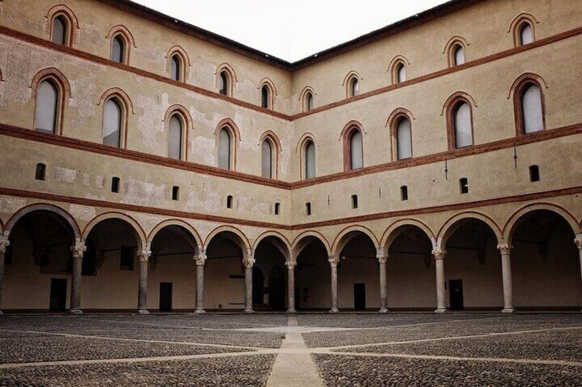 A courtyard with multiple arches and a central open space. 1