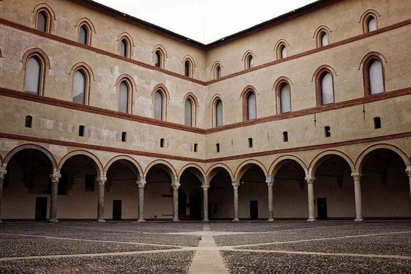 A courtyard with multiple arches and a central open space. 2