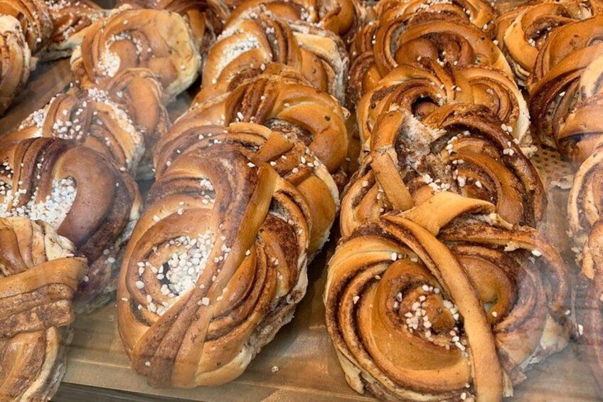 A display of cinnamon rolls with sugar crystals. 4