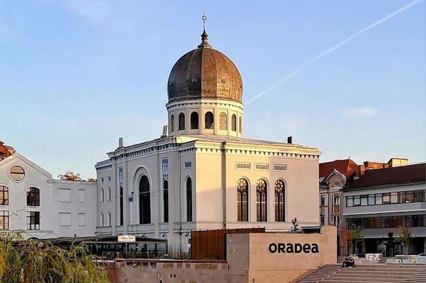 A historic building with a dome and arched windows, labeled 'ORAPEA.' 4