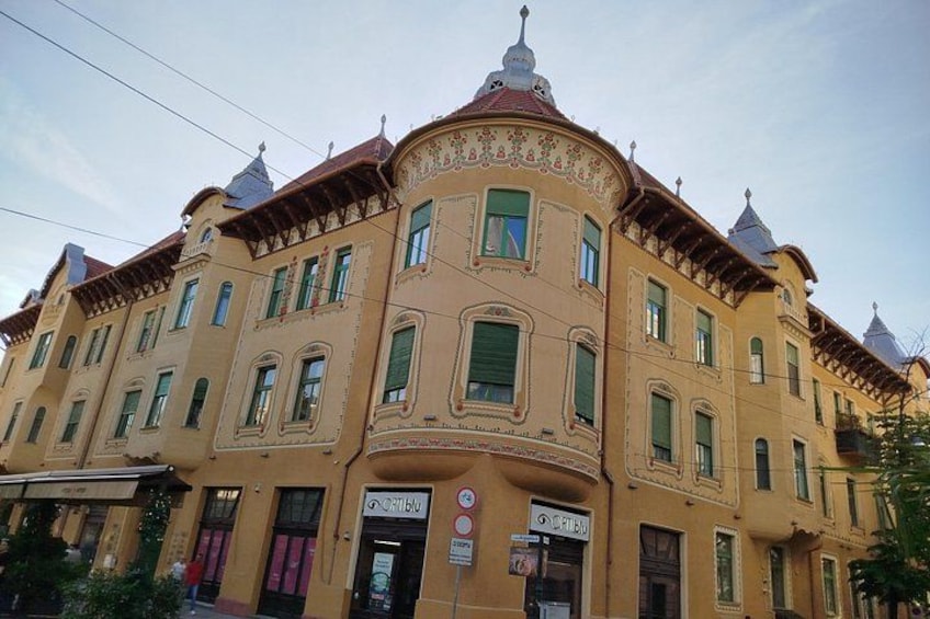 A historic building with ornate architectural details, including a dome and multiple windows. 3