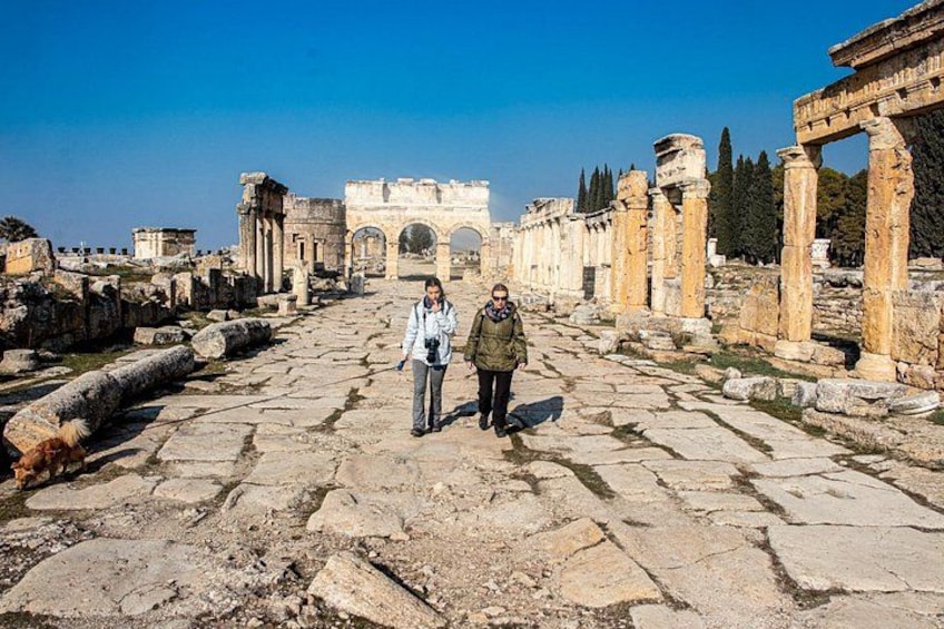 Ancient ruins with stone pathways and columns. 3