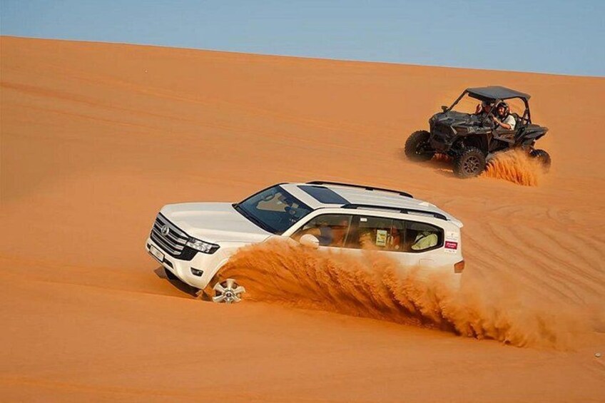 Dubai Desert Safari with Camel Ride Sand Boarding and BBQ Dinner 1