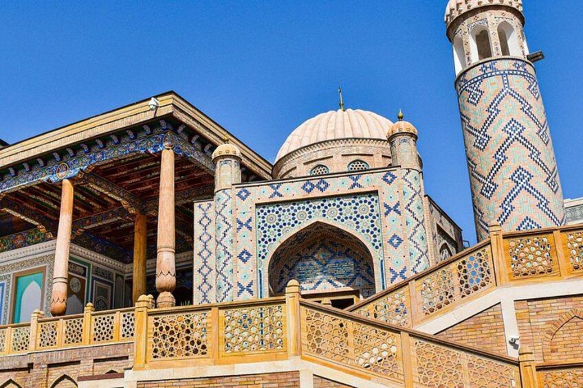 A mosque with intricate tile work, domes, and minarets. 3