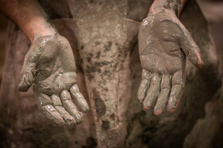 Hands covered in mud. 1