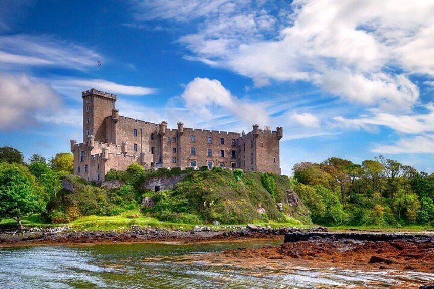 A castle on a hill overlooking a body of water. 2